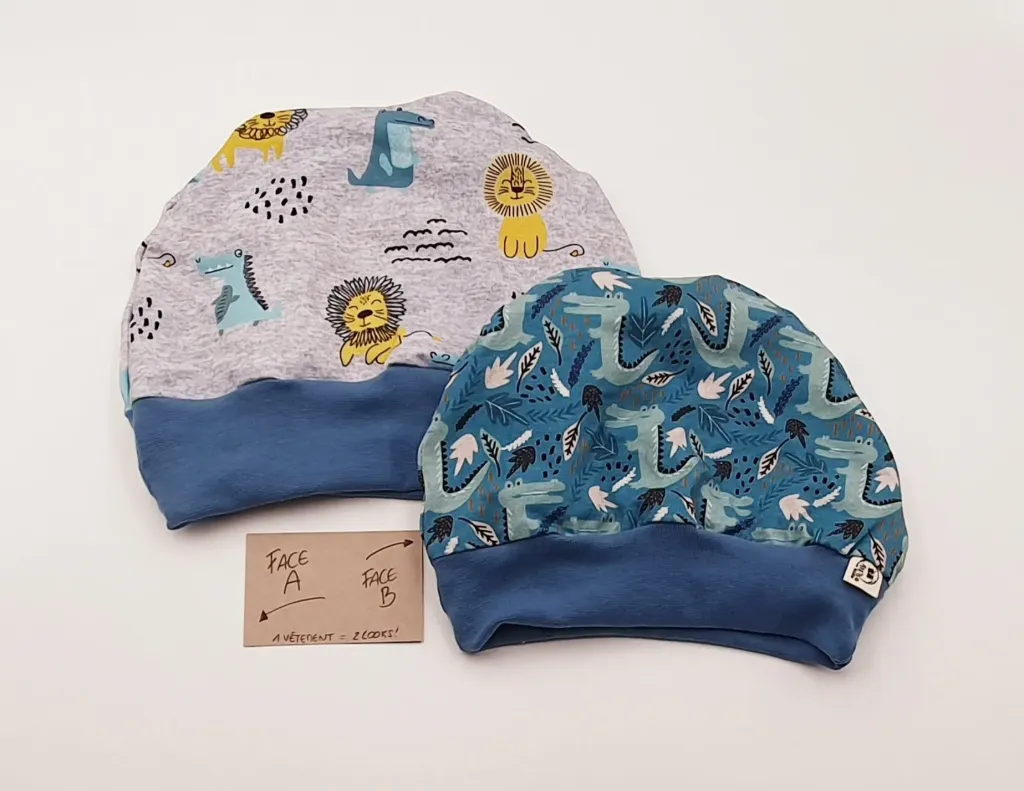 Bonnet réversible avec bord-côte LIONS/DINOS